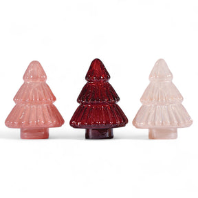 three embossed mercury glass Christmas trees in blush pink, deep red, and iridescent pearl