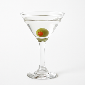 Realistic fake martini glass with olive garnish for display or decor use.