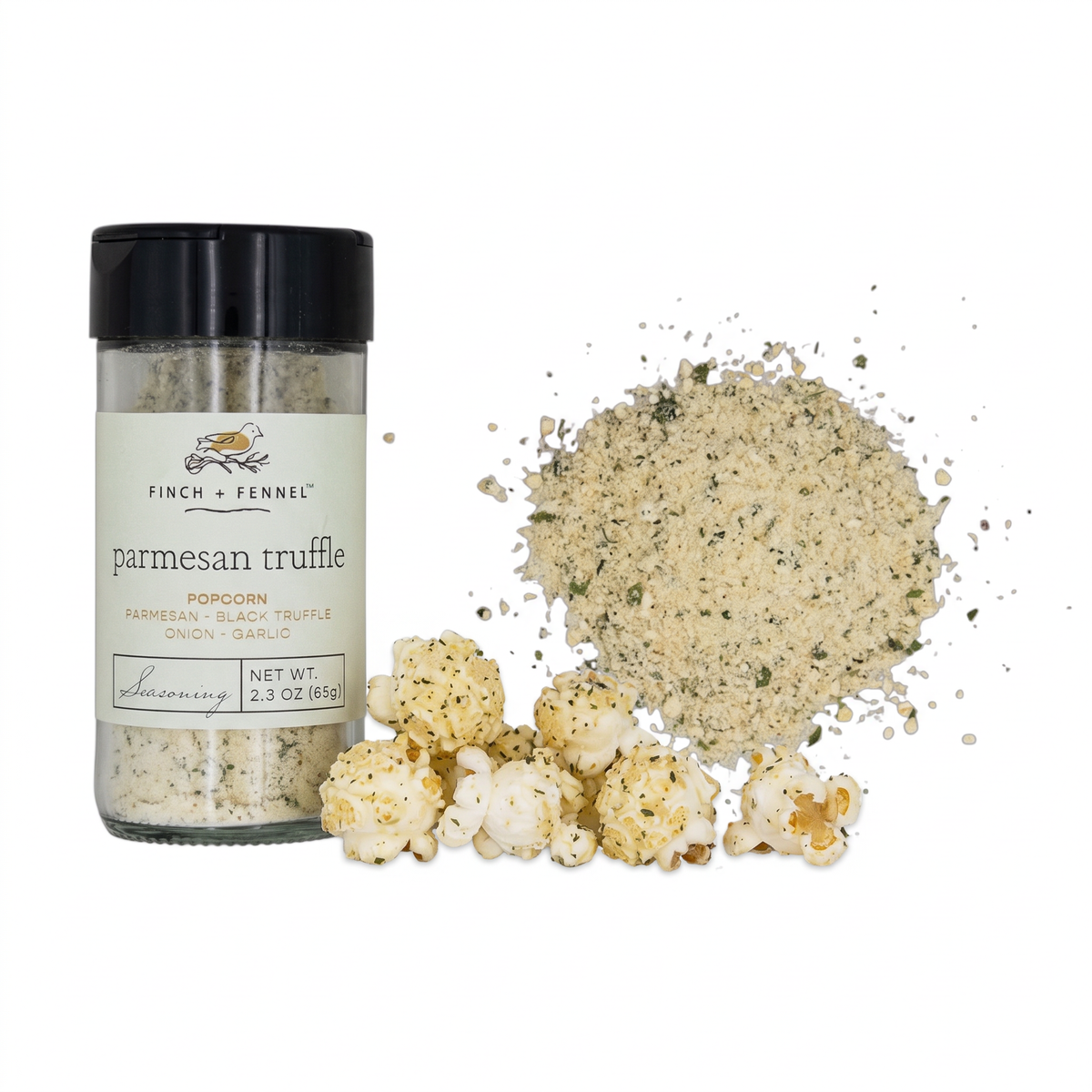 Finch + Fennel Parmesan Truffle Popcorn Seasoning in a clear jar with a black lid beside a sprinkle of seasoning