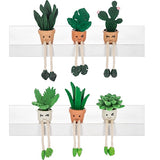 Resin plant shelf sitters with smiling pots, rope legs, and flocked greenery