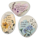 Resin art rock with floral design and inspirational quote in soft watercolor hues