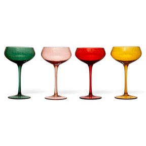 Fluted stemmed 8 oz. coupe glasses in green, blush pink, red, and amber, each with a rounded bowl and slender stem.
