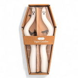 Set of two 9-inch hand-painted ghost taper candles in coffin-shaped packaging