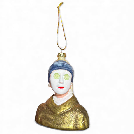 Glass ornament of Girl with a Pearl Earring wearing a spa mask and cucumber slices on eyes