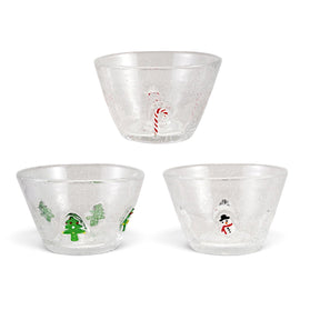 Three clear glass holiday bowls with bubbled details and embedded red candy canes, green Christmas trees, or snowmen
