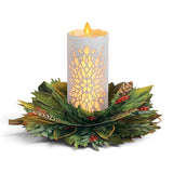 Glowing holiday candle pop-up card with rechargeable warm LED light and festive winter greenery wreath