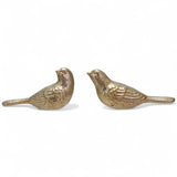 Two gold cast iron bird figurines in different styles
