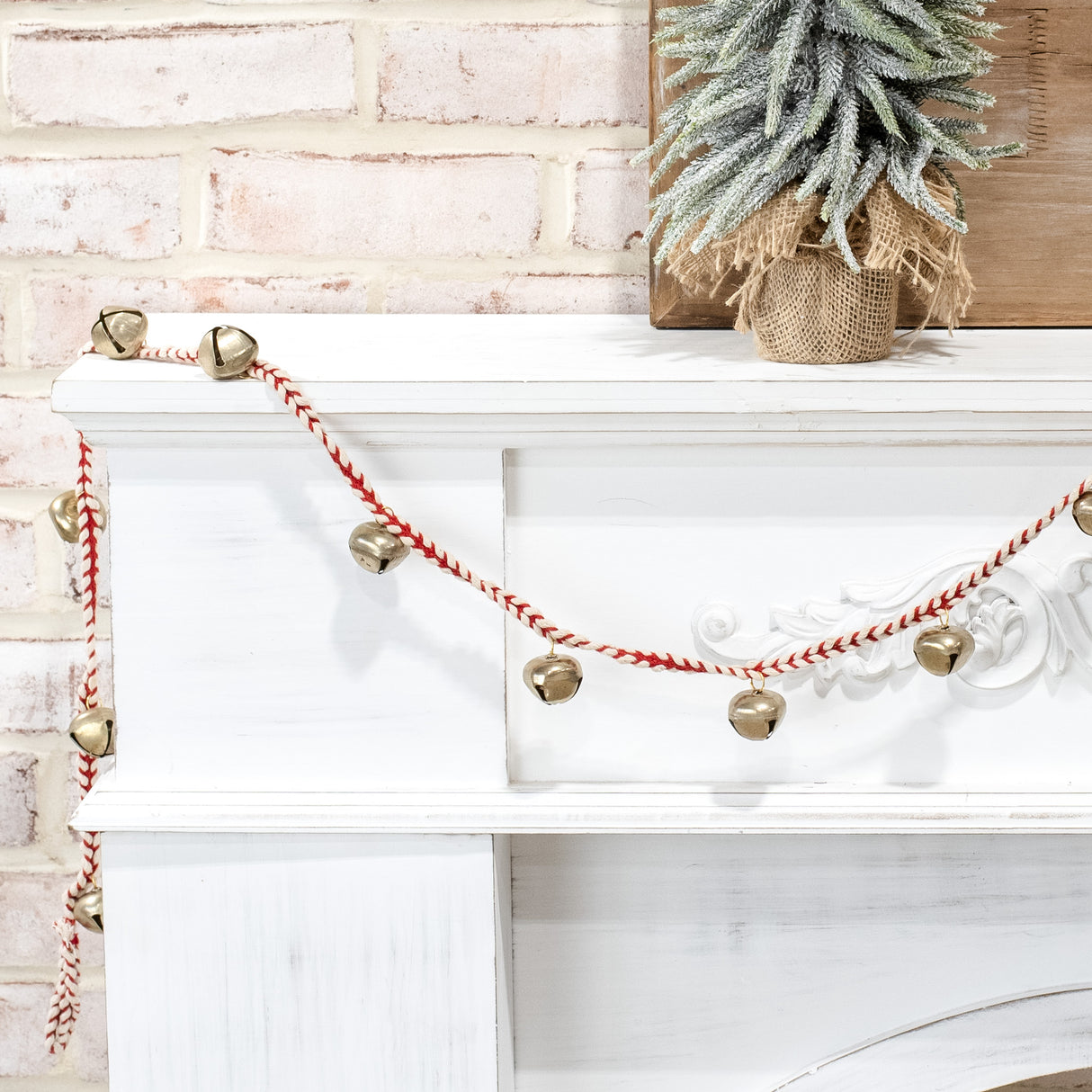 gold bell garland on red and white braided cord