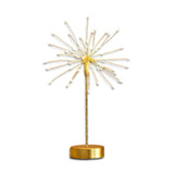 Gold starburst LED table light with 60 warm white bulbs on a gold metal base