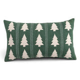 Green cotton slub lumbar pillow with cream embroidered Christmas trees and vertical decorative stitching
