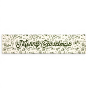 Green toile Merry Christmas cotton table runner with embroidered lettering
