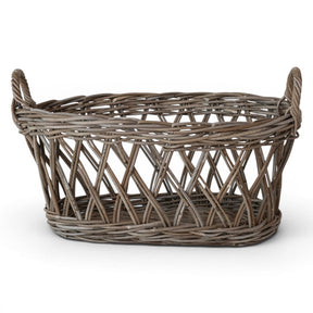 grey washed rattan oval basket with handles for blanket storage and home organization
