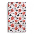 Halloween-themed towel with pumpkins, ghosts, and bats on a white background