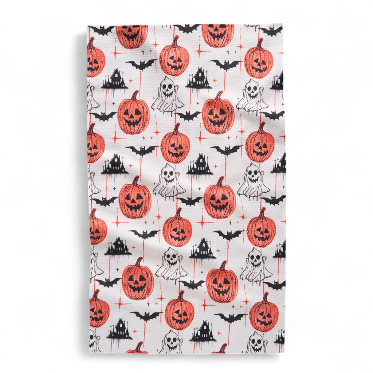 Halloween-themed towel with pumpkins, ghosts, and bats on a white background
