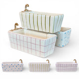 hand painted stoneware bathtub trinket dish with gold faucet detail