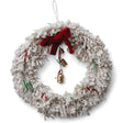 18" handmade ivory yarn wreath with red bow, ribbons, and bells