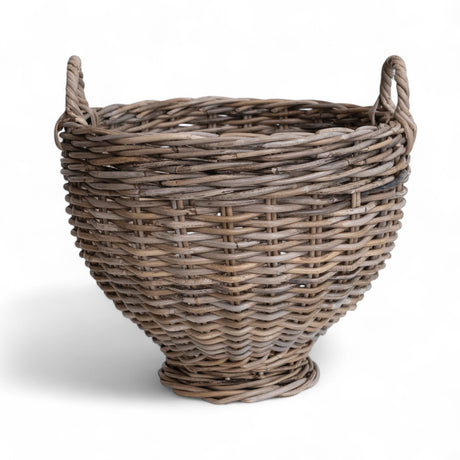 Handwoven rattan footed basket with handles in a natural finish, measuring 15.75 inches round and 16 inches high.