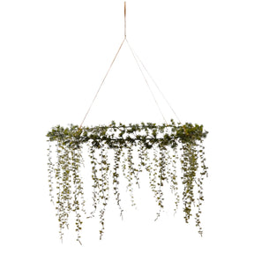hanging faux cedar wreath measuring approximately 24 inches across.
