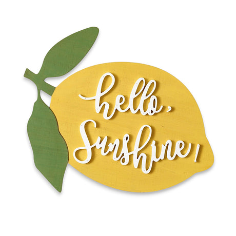 Lemon-shaped wooden sign with "Hello, Sunshine!" in raised white script, featuring a yellow body and green leafy accents.