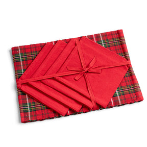 Four holiday plaid placemats with four solid red cloth napkins