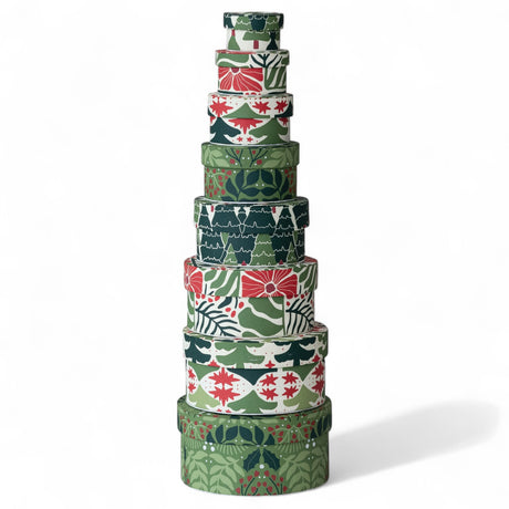 Stacked round holiday nesting gift boxes in red, green, and white patterns