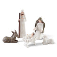 Five-piece nativity set with Mary, Joseph, baby Jesus in a manger, a resting donkey, and a sheep in soft white and earthy tones.