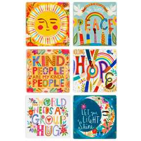 Colorful ceramic fridge magnets with uplifting messages and whimsical illustrations