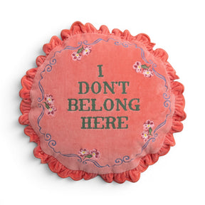 Coral pink I Don’t Belong Here round cotton velvet pillow with floral details and ruffled trim