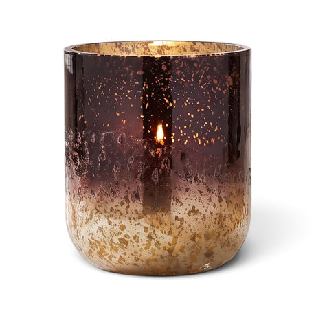 ILLUME Midnight Pumpkin candle in a brown and gold radiant glass vessel with pumpkin spice, birchwood, and maple cinnamon fragrance