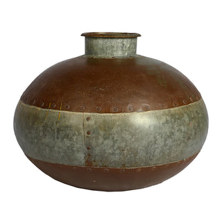 large iron water pot by blue ocean
