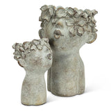 decorative cement face planters with floral hair detail for indoor plants