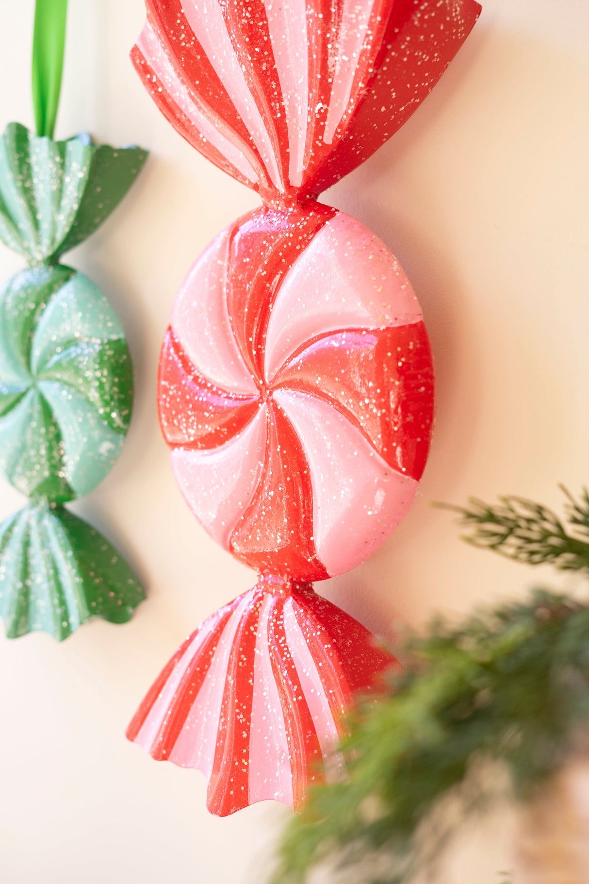 Painted metal wrapped candy ornaments with glitter details