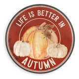32-inch round Life Is Better in Autumn metal wall sign with orange and cream pumpkins