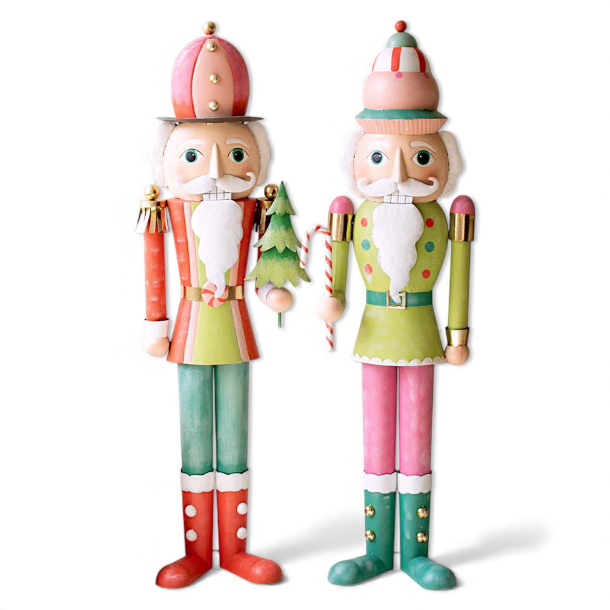 Two life-size painted metal nutcrackers in pastel holiday colors standing on display indoors