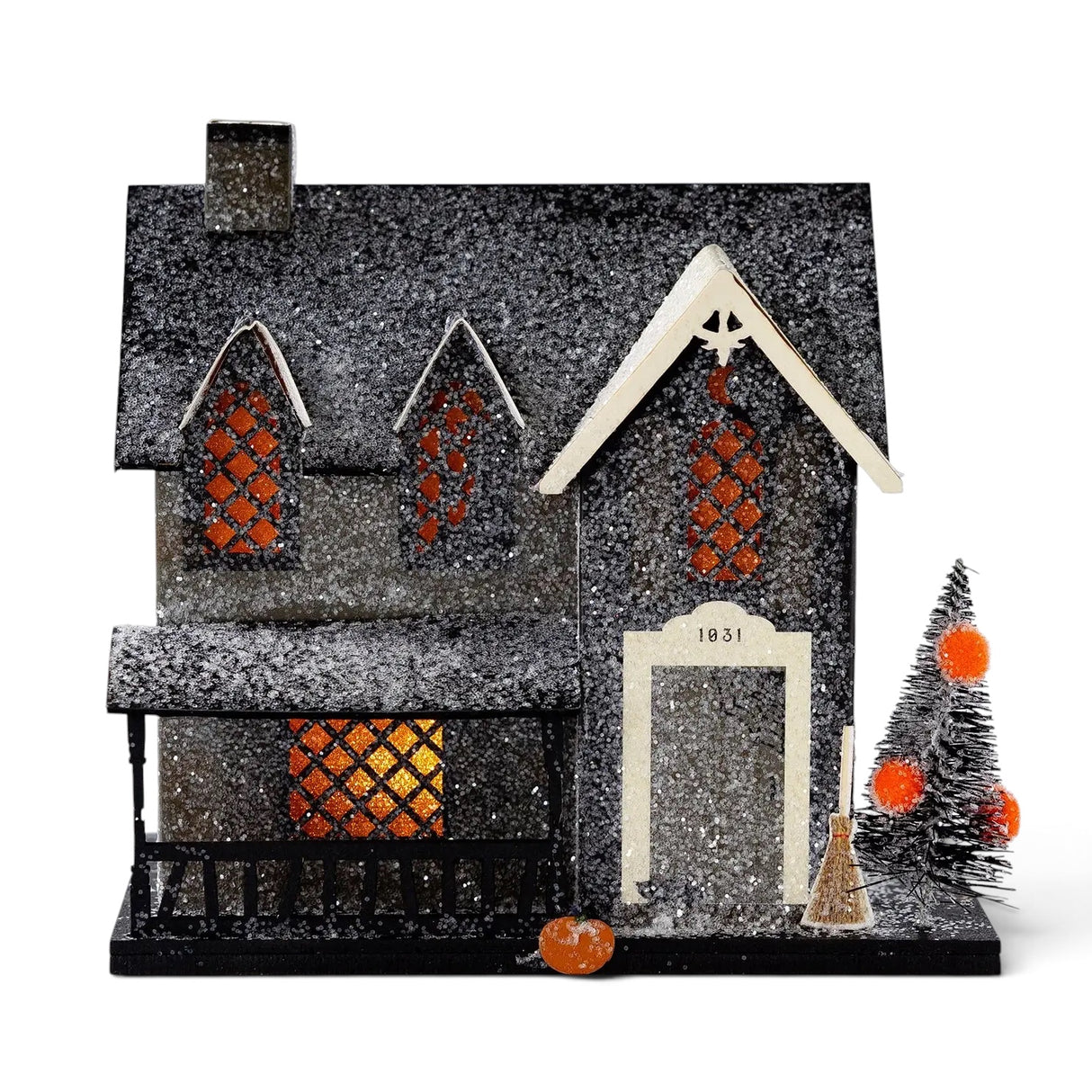 Lighted glitter Witch Cottage Halloween village house with orange windows, porch, tree, broom, and pumpkin