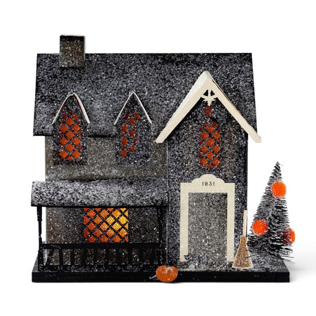 Lighted glitter Witch Cottage Halloween village house with orange windows, porch, tree, broom, and pumpkin