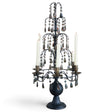 Tall matte black metal candelabra with tiered smoky acrylic crystal drops, six taper holders, and a sculpted pedestal base