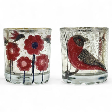 Two mercury glass tealight holders with red bird and flower designs
