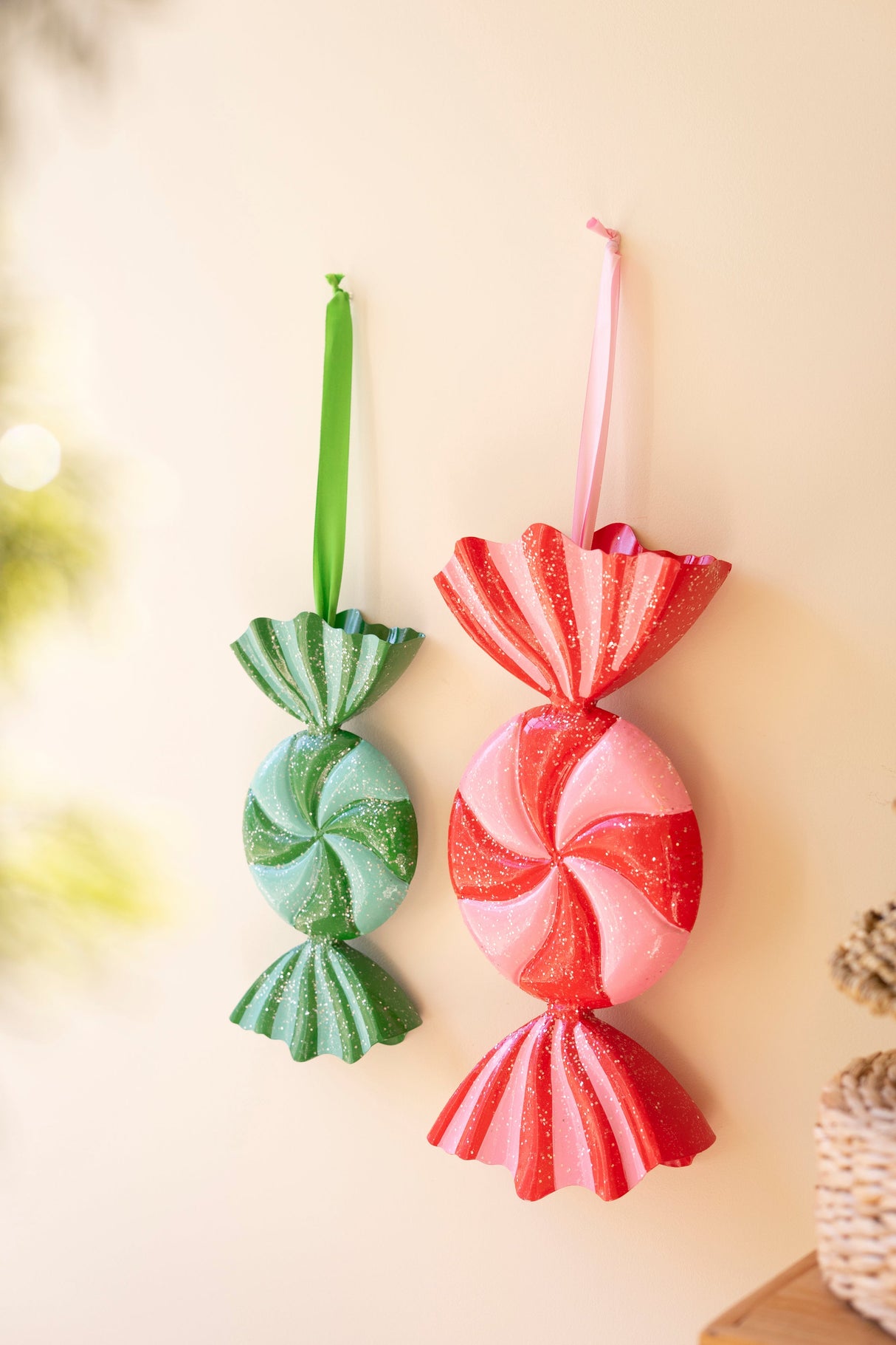 Painted metal candy ornaments displayed as colorful Christmas decor