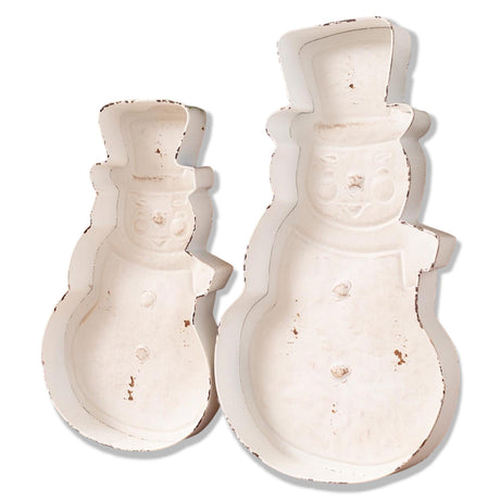 Two distressed white metal snowman trays