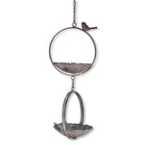 Two-tiered iron hanging bird feeder with decorative bird accent and floral design.