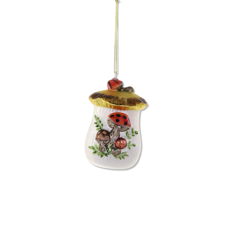 Glass mushroom cookie jar ornament with painted mushrooms and gold lid