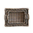 Stack of three woven rattan trays with handles, rectangular shape, natural color,