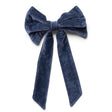 Navy cotton velvet decorative clip-on bow measuring 8 inches wide by 13 inches high.