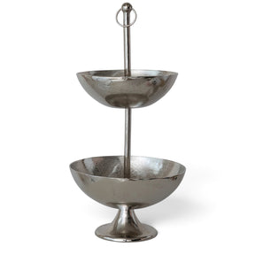 Nickel-finished cast aluminum two-tier bowl with graduated round bowls, a flared pedestal base, and a tall center post topped with a ring finial