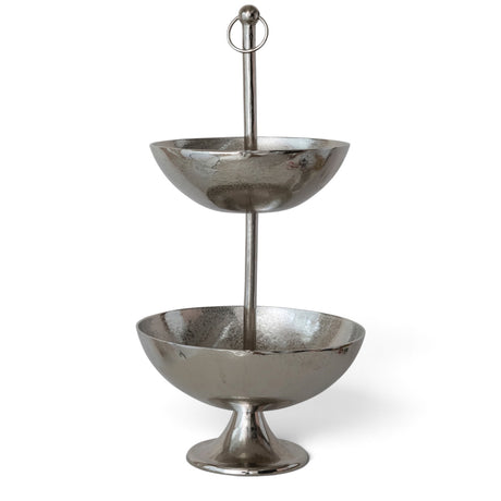 Nickel-finished cast aluminum two-tier bowl with graduated round bowls, a flared pedestal base, and a tall center post topped with a ring finial