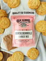 Old School Brand Snickerdoodle Cookie Mix pouch with baked cinnamon sugar cookies