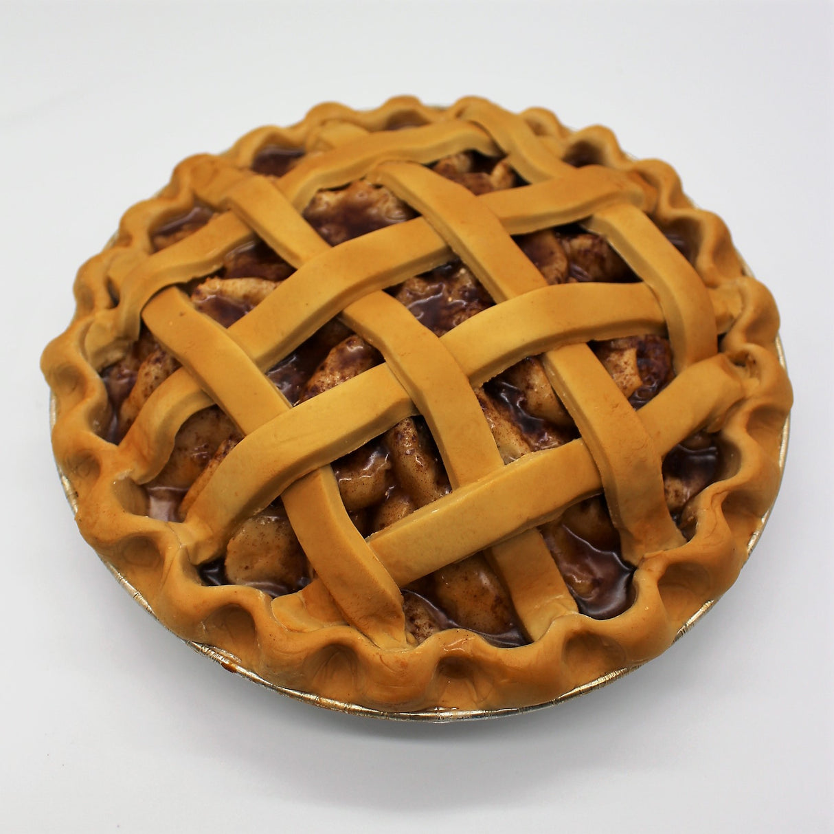 Apple pie with glazed apple filling and detailed lattice crust