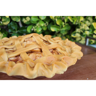 Apple pie with glazed apple filling and detailed lattice crust