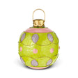 Oversized green metal ball ornament with pink polka dots, purple loop patterns, glitter accents, and a gold-tone hanging loop